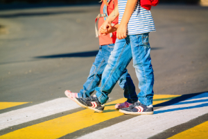 Kids using crosswalk. 