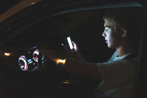 Teenager texting while driving.
