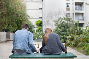 alcoholism young people drinking beer on the bench