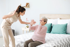 Caregiver mistreating senior woman