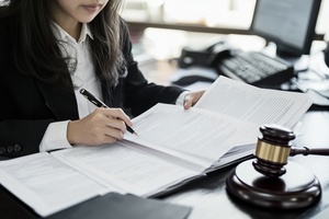 Lawyer working on court documents with gavel